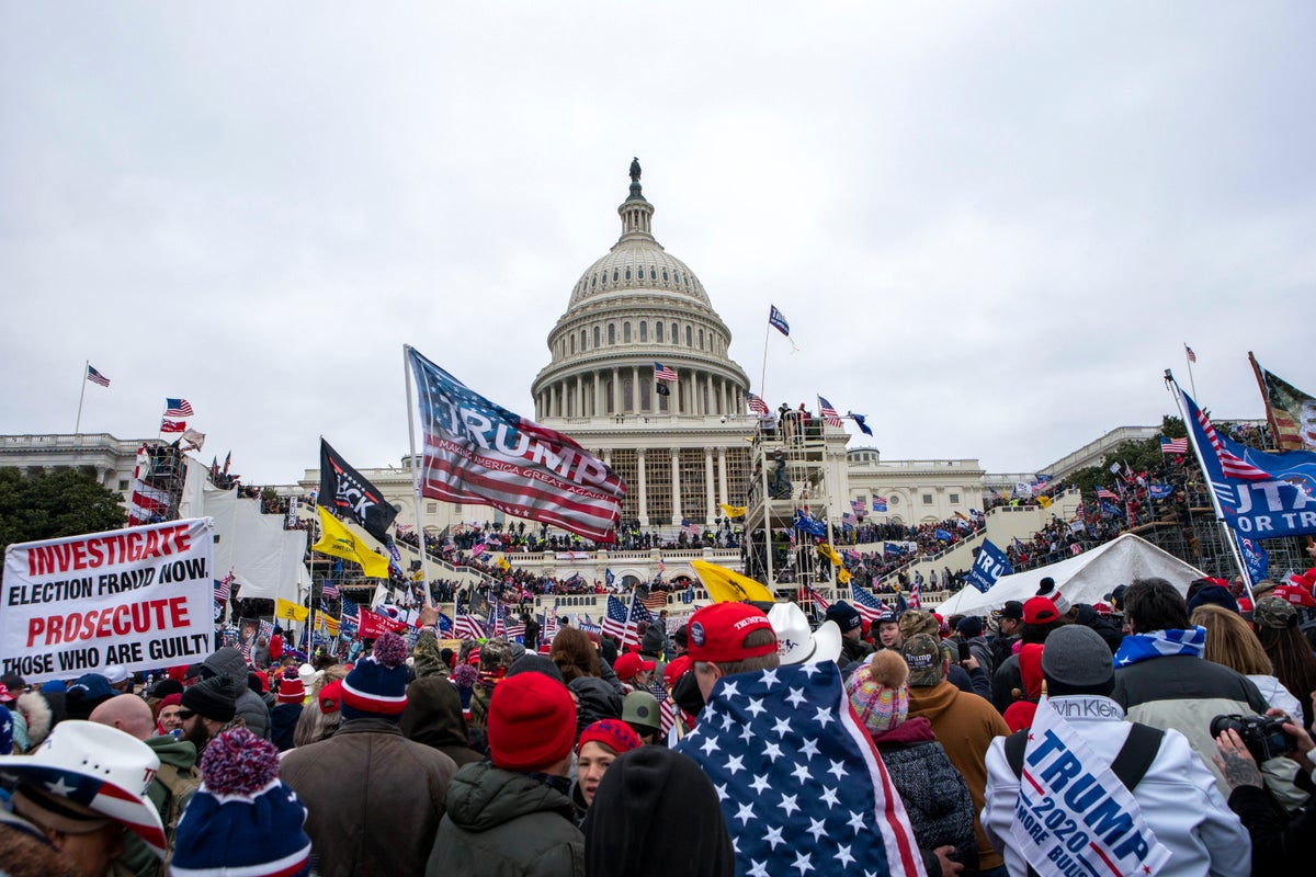 Rioters loyal to President Donald Trump rally at the U.S. Capitol in Washington on Jan. 6, 2021. A new poll shows that a year after the deadly Jan. 6 insurrection at the U.S. Capitol, only about 4 in 10 Republicans recall the attack by supporters of former President Donald Trump as very violent or extremely violent. A new poll shows that a year after the deadly Jan. 6 insurrection at the U.S. Capitol, only about 4 in 10 Republicans recall the attack by supporters of former President Donald Trump as very violent or extremely violent. (AP Photo/Jose Luis Magana, File)