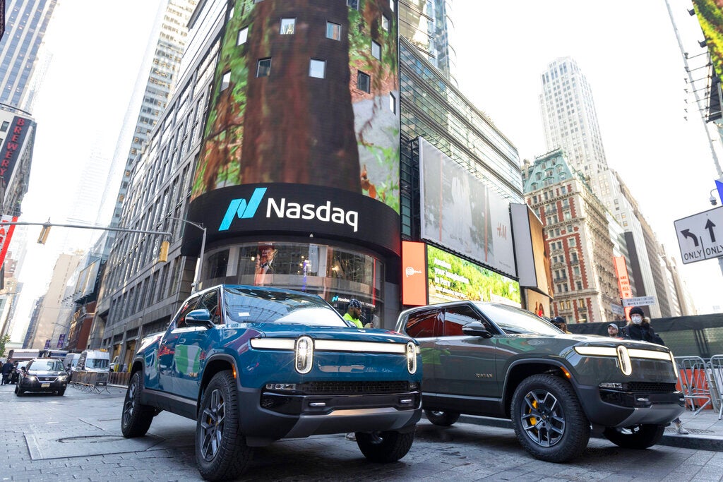 Rivian R1T all-electric truck in Times Square on listing day, on Wednesday, Nov. 10, 2021, in New York. Electric vehicle maker Rivian Automotive will announce Thursday, Dec. 15, that it's building a $5 billion battery and assembly plant east of Atlanta that's projected to employ 7,500 workers, sources briefed on the decision told The Associated Press. (Ann-Sophie Fjello-Jensen/AP Images for Rivian Automotive, LLC)