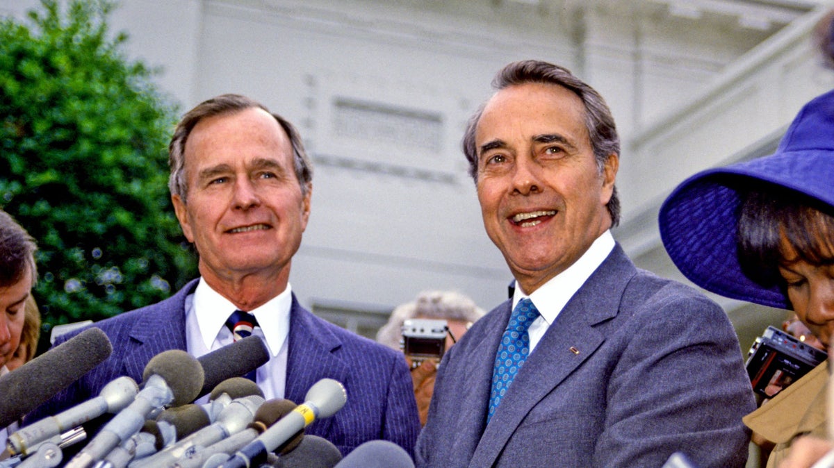 <i>President-elect George H.W. Bush and Senate Republican Leader Bob Dole meet reporters at the White House, Nov. 28, 1988. / Photo Credit: Shutterstock</i>