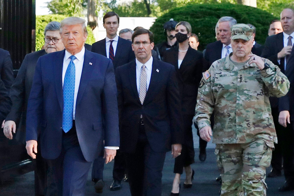 In this June 1, 2020 file photo, President Donald Trump departs the White House to visit outside St. John's Church, in Washington. Part of the church was set on fire during protests on Sunday night. Walking behind Trump from left are, Attorney General William Barr, Secretary of Defense Mark Esper and Gen. Mark Milley, chairman of the Joint Chiefs of Staff. Milley says his presence “created a perception of the military involved in domestic politics.” He called it “a mistake” that he has learned from. (AP Photo/Patrick Semansky)