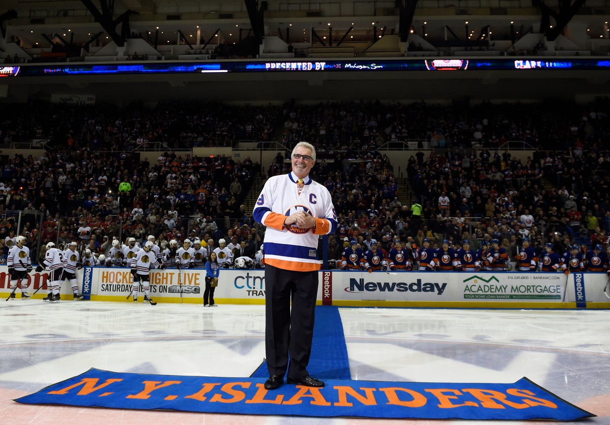 Gillies smiles as fans cheer before he drops a ceremonial puck prior to a 2014 game. (AP Photo/Kathy Kmonicek)