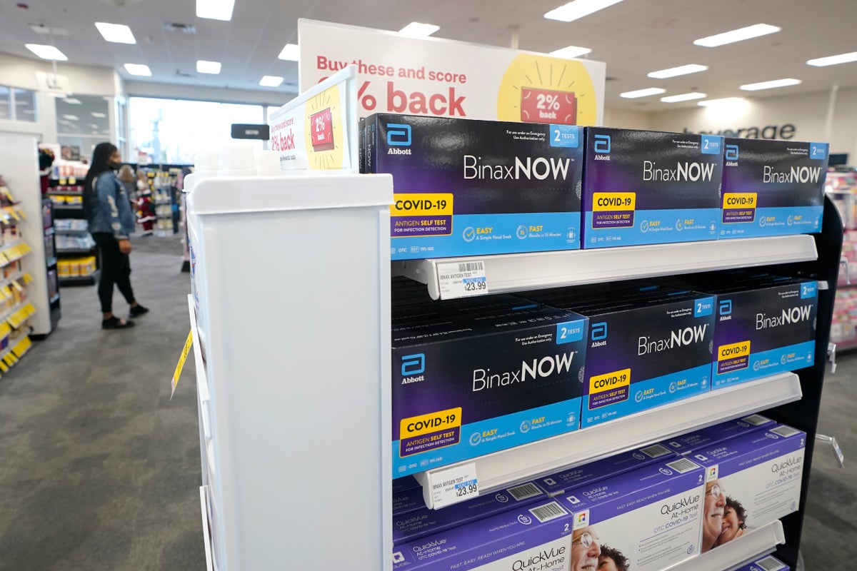 Boxes of BinaxNow home COVID-19 tests made by Abbott and QuickVue home tests made by Quidel are shown for sale Monday, Nov. 15, 2021, at a CVS store in Lakewood, Wash., south of Seattle. (AP Photo/Ted S. Warren, File)