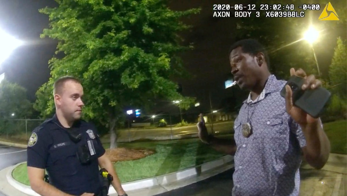 This screengrab taken from body camera video provided by the Atlanta Police Department shows Rayshard Brooks speaking with Officer Garrett Rolfe in the parking lot of a Wendy's restaurant, late Friday, June 12, 2020, in Atlanta. (Atlanta Police Department via AP)