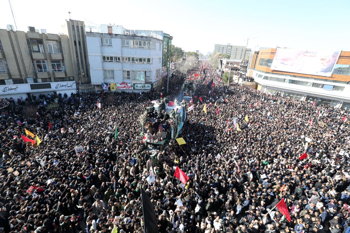 <i>Iranians carrying the coffin of late Iranian Revolutionary Guards Corps (IRGC) Lieutenant general and commander of the Quds Force Qasem Soleimani and his allies in his home town Kerman, Iran, 07 January 2020. / Photo Credit: STR/EPA-EFE/Shutterstock</i>