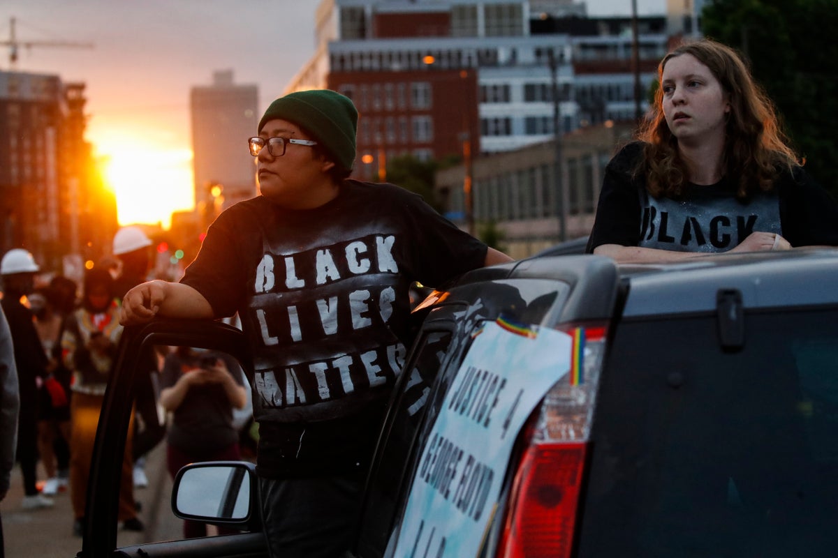 Protesters gather on South Washington Street, Sunday, May 31, 2020, in Minneapolis. Protests continued following the death of George Floyd, who died after being restrained by Minneapolis police officers on Memorial Day. (AP Photo/John Minchillo)