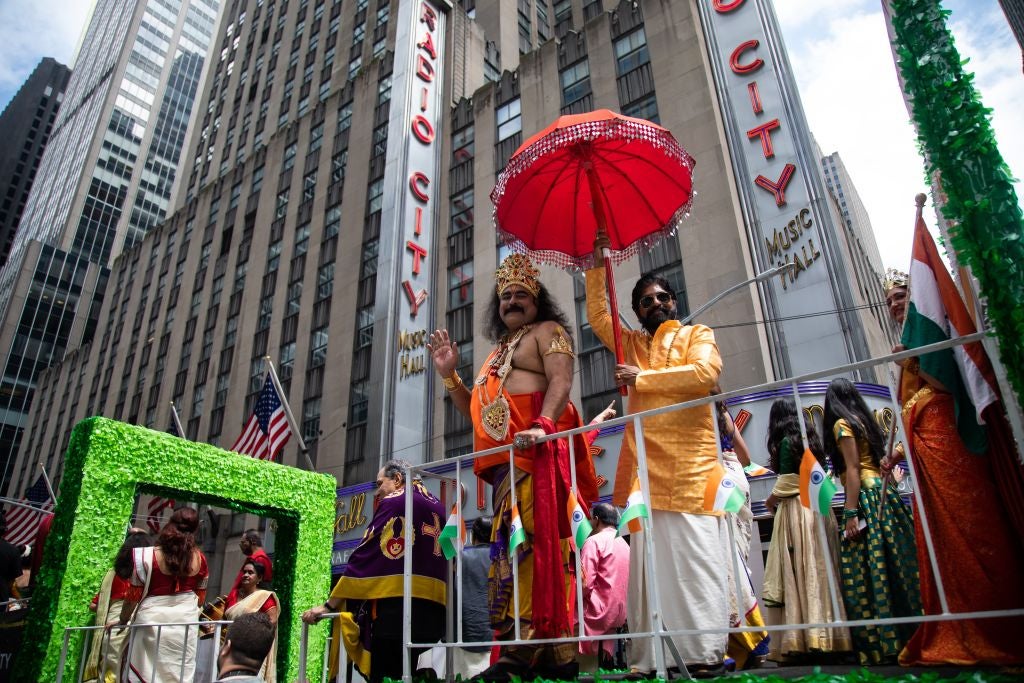 Participants ride on a float during the first-ever annual Asian American and Pacific Islander AAPI Cultural and Heritage Parade in New York, the United States, on May 15, 2022. New York City held its first-ever annual Asian American and Pacific Islander AAPI Cultural and Heritage Parade on Sunday with the participation of immigrants from China, South Korea, India, Malaysia, Thailand, and others. (Photo by Michael Nagle/Xinhua via Getty Images)