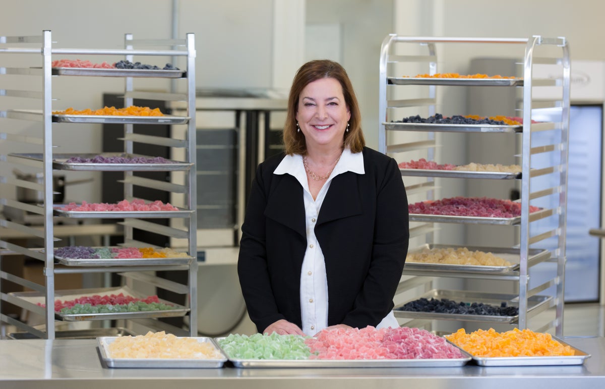 <i>Wana Brands CEO and co-founder Nancy Whiteman stands with infused gummies. / Photo Credit: Wana Brands</i>