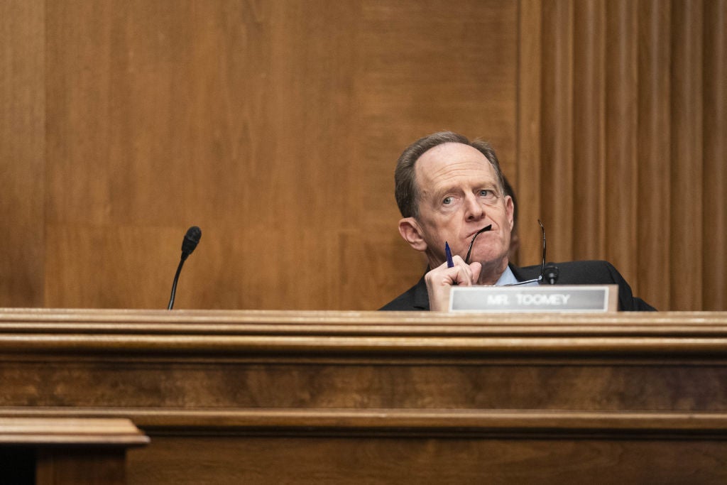 Senator Pat Toomey, a Republican from Pennsylvania and ranking member of the Senate Banking, Housing, and Urban Affairs Committee, listens during a hearing in Washington, D.C., U.S., on Tuesday, Dec. 14, 2021. The hearing is titled 