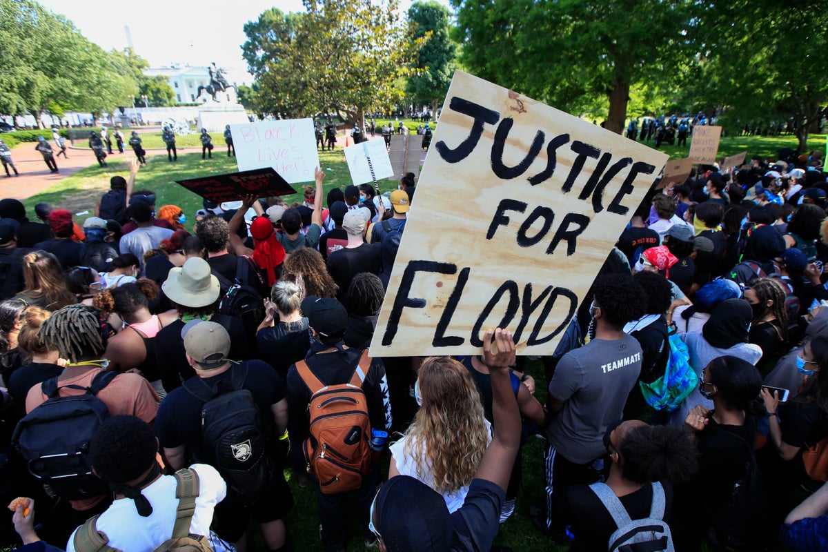 Demonstrators gather to protest the death of George Floyd, Sunday, May 31, 2020, near the White House in Washington. Floyd died after being restrained by Minneapolis police officers. (AP Photo/Manuel Balce Ceneta)