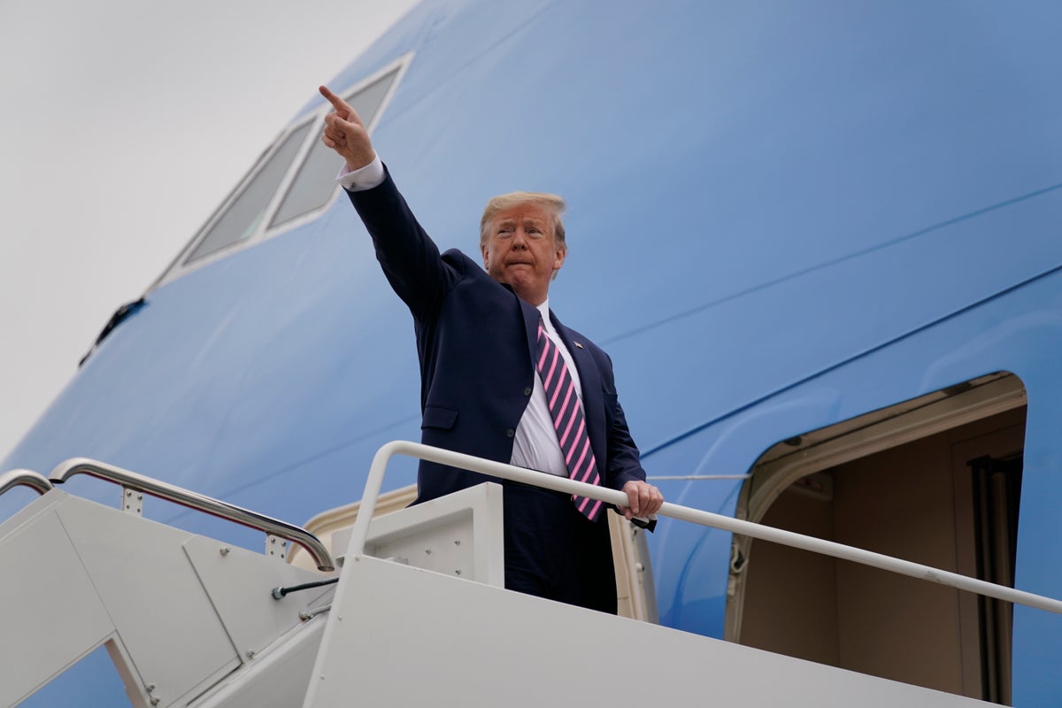 President Donald Trump boards Air Force One for a trip to Phoenix to visit a Honeywell plant that manufactures protective equipment, Tuesday, May 5, 2020, in Andrews Air Force Base, Md. (AP Photo/Evan Vucci)