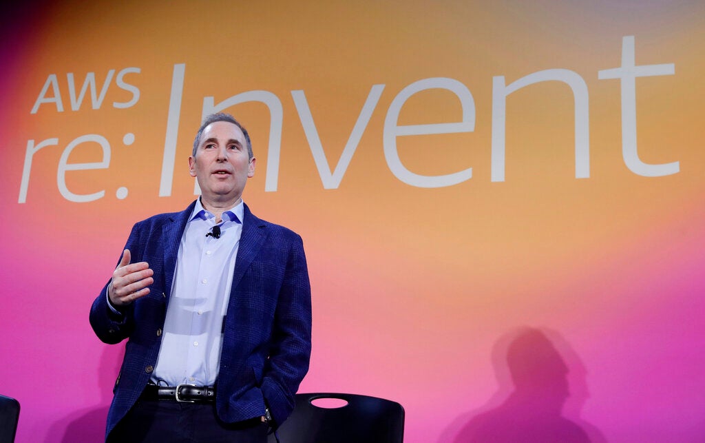 In this Dec. 5, 2019, file photo, AWS CEO Andy Jassy, discusses a new initiative with the NFL during AWS re:Invent 2019 in Las Vegas. In his first letter to Amazon shareholders, Jassy offered a defense of wages and benefits the company gives its warehouse workers while also vowing to improve injury rates inside the facilities. Jassy, who took over from Amazon founder Jeff Bezos as CEO last July, wrote the company has researched and created a list of the top 100 “employee experience pain points” and is working to solve them. A report released this week by a coalition of four labor unions found Amazon employed 33% of all U.S. warehouse workers in 2021, but was responsible for 49% of all injuries in the industry. (Isaac Brekken/AP Images for NFL, File)