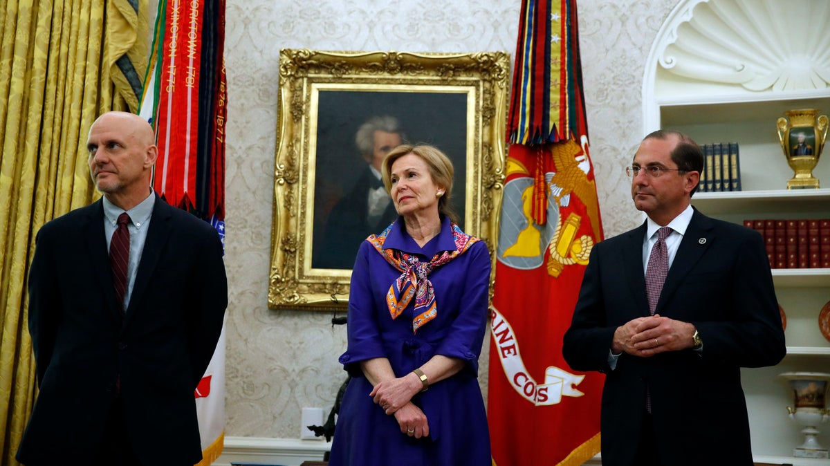 Stephen Hahn, commissioner of the U.S. Food and Drug Administration, Dr. Deborah Birx, White House coronavirus response coordinator, and Health and Human Services Secretary Alex Azar, listen during a meeting with Daniel O'Day, CEO of Gillead Sciences Inc., and President Donald Trump in the Oval Office of the White House, Friday, May 1, 2020, in Washington. (AP Photo/Alex Brandon)
